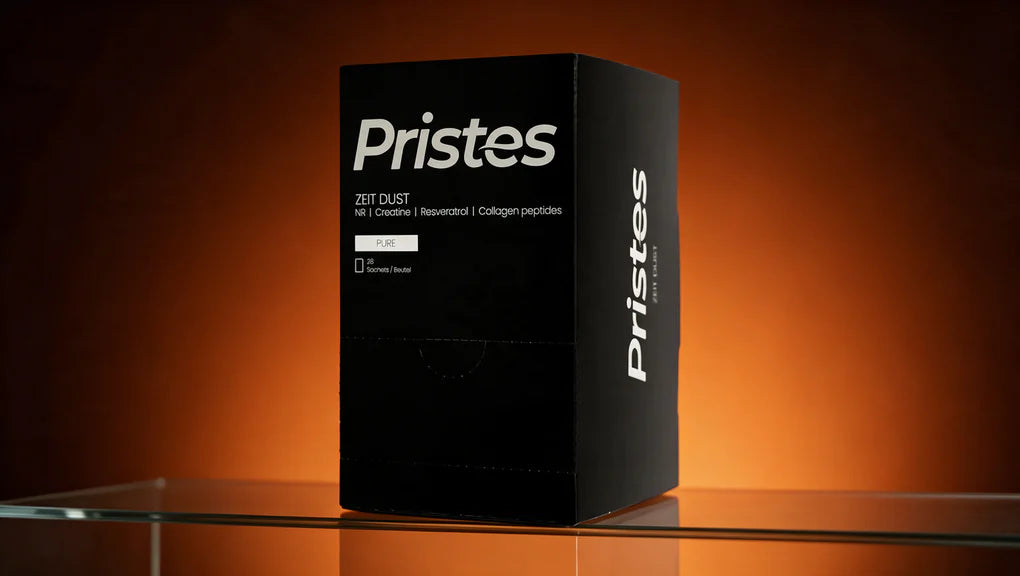 Confezione di Zeit Dust – Pure su un tavolo di vetro, sotto un fascio di luce arancione